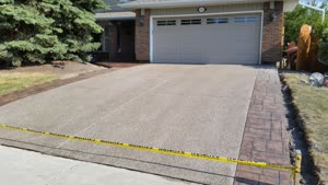 Exposed Concrete Driveway with Stamped Border